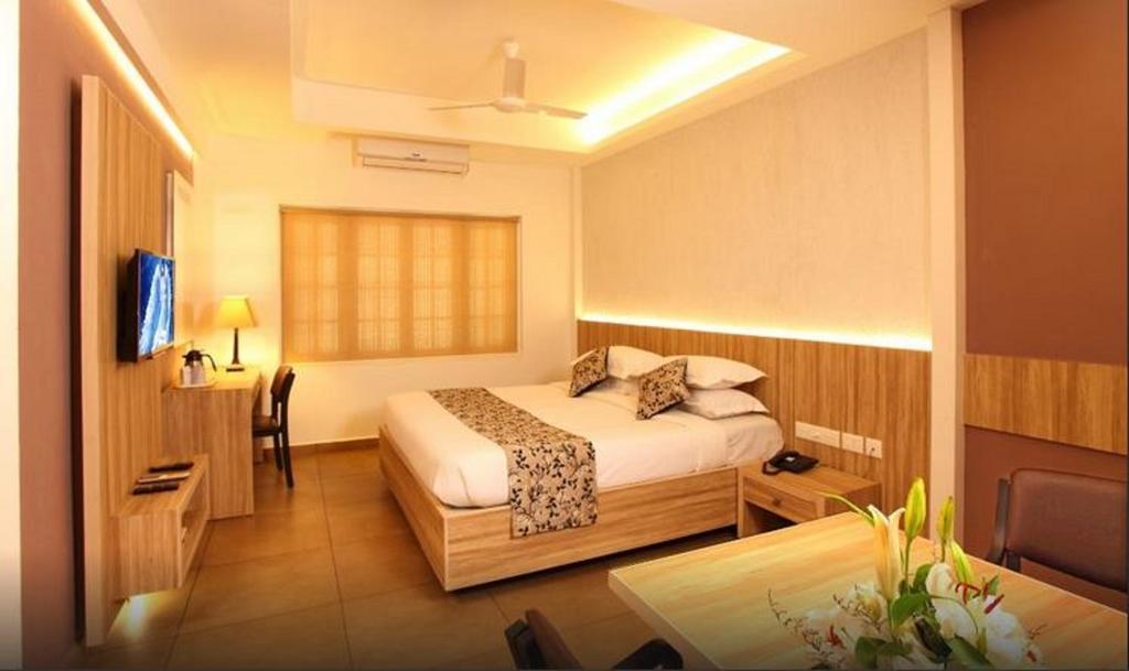 Hotel Luciya Palace Thrissur Rum bild